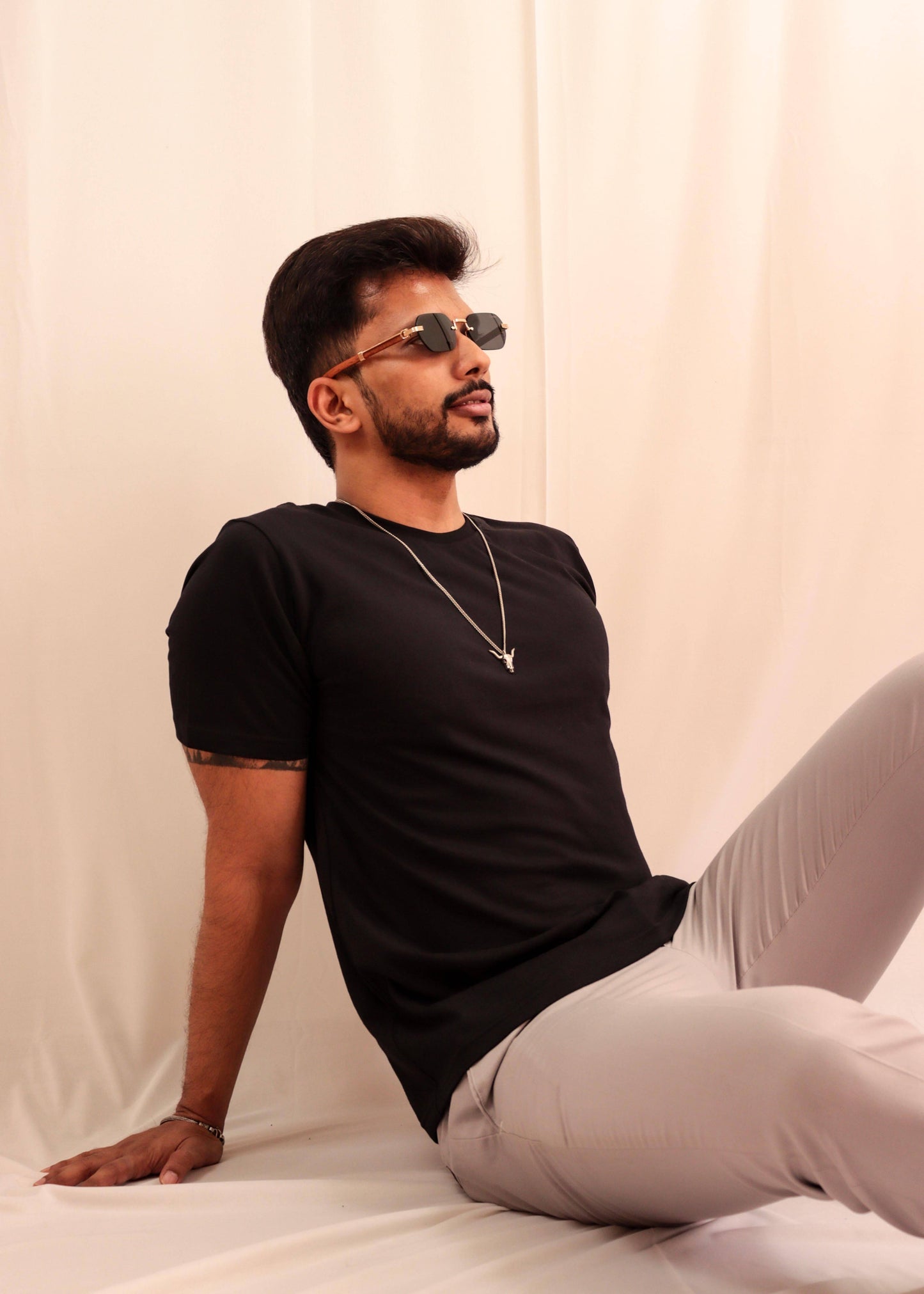 Black cotton solid tshirt wear by a model while doing a photoshoot